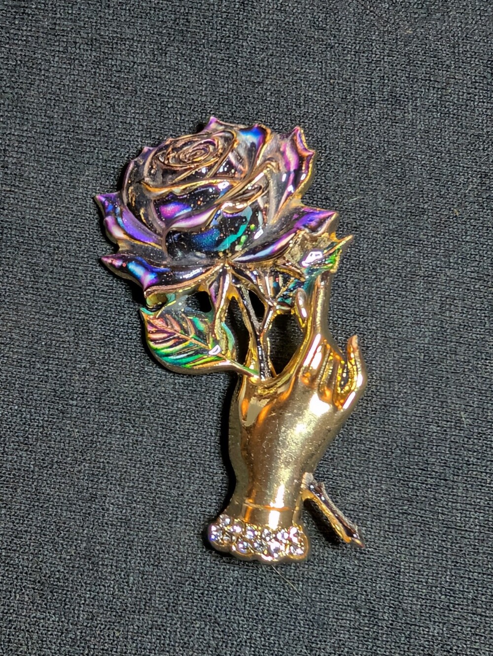 Gold Hand Rose Brooch with Iridescent Purple-Green Petals
